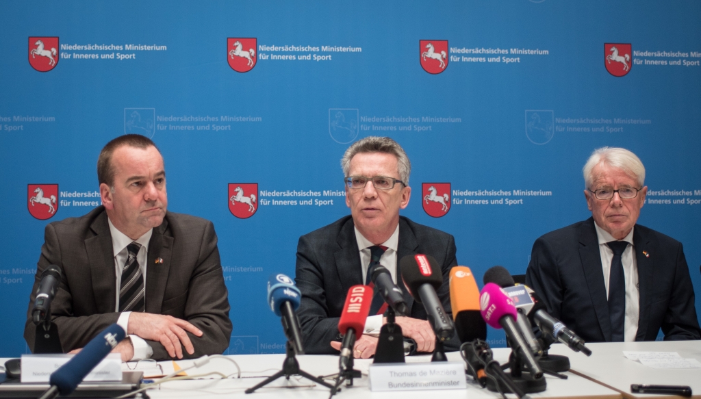 Lower Saxony's state Interior Minister Boris Pistorius German Federal Interior Minister Thomas de Maiziere and Reinhardt Rauball acting head of the German soccer federation attend a press conference in Hannover northern Germany Tuesday Nov. 17 2015