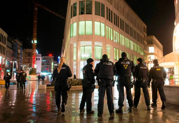 Heavy armed police patrol downtown Hanover after the match was called off by police due to a security threat