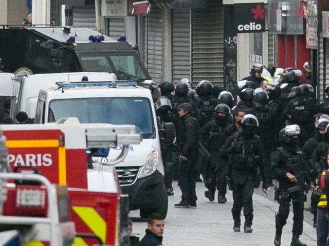 Explosions, gunfire as Paris police raid apartment