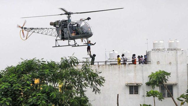 Residents of Vardharajapuram near Tambaram being airlifted to safety on Monday