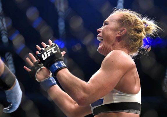 Holly Holm celebrates after defeating Ronda Rousey during