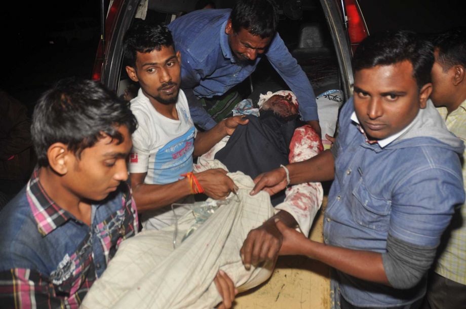 A man injured in an attack on a Shiite mosque is carried for treatment in Bogra district Bangladesh Thursday Nov. 26 2015. Police say at least five unidentified assailants armed with fire arms have opened fire on devotees during evening prayer in a Sh