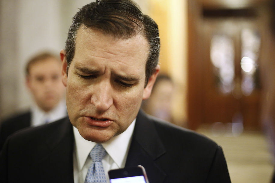 U.S. Senator Ted Cruz talks to reporters after the Senate passed at $1.1 trillion spending bill following a long series of votes many on procedural matters or to confirm members of the Obama administration at the U.S. Capitol in Washington Decemb