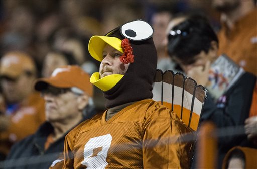 A Texas fan dressed up as a Thanksgiving turkey shows disappointment over the performance of the Longhorns in a game against TCU on Thursday Nov. 27 2014 in Austin Texas