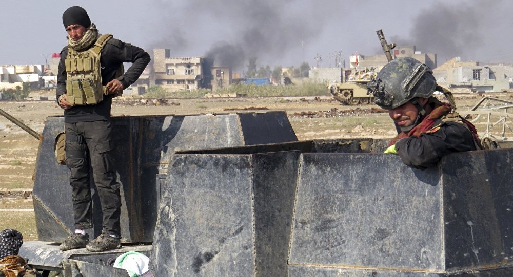 Iraq forces supported by U.S.-led coalition airstrikes advance their position during clashes with Islamic State group in the western suburbs of Ramadi the capital of Iraq's Anbar province