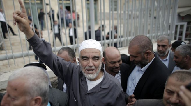 27 2015 shows Raed Salah the head of the radical northern wing of the Islamic Movement in Israel gesturing outside a Jerusalem court after he was convicted. AFP