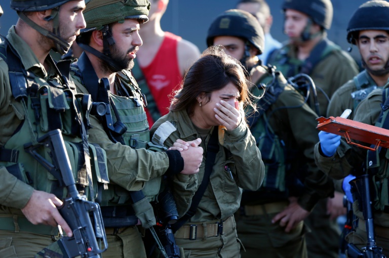 AFP  Ahmad Gharabli Israeli soldiers react at the scene of a stabbing attack that killed one of their number near the West Bank village of Khirbit Al Misbah