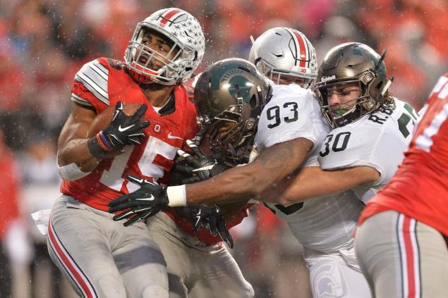 Ezekiel Elliott blames the coaches for giving him the ball just 12 times in Ohio State's 17-14 loss to Michigan State