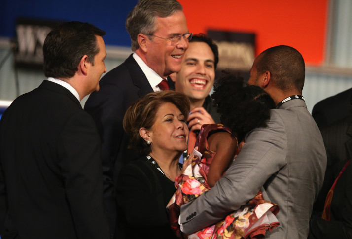 Jeb Bush and wife Columba Bush greet people on stage after the Republican Presidential Debate. | Getty