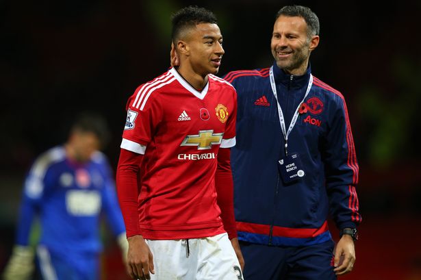 Jesse Lingard of Manchester United is congratulated by assistant manager Ryan Giggs