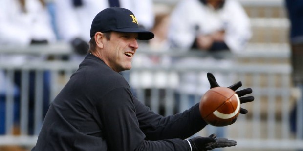 Jim Harbaugh smashed a buckeye with a hammer at Bo Schembechler's grave