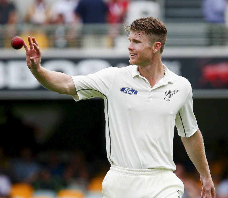 Jimmy Neesham returns to his mark while bowling during New Zealand's first test against Australia