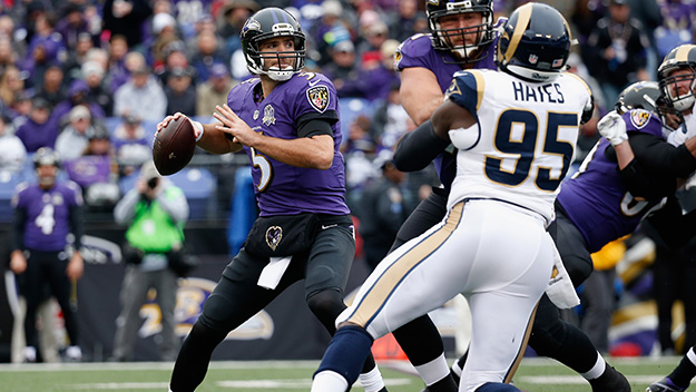 Joe Flacco of the Baltimore Ravens throws a pass against the St. Louis Rams