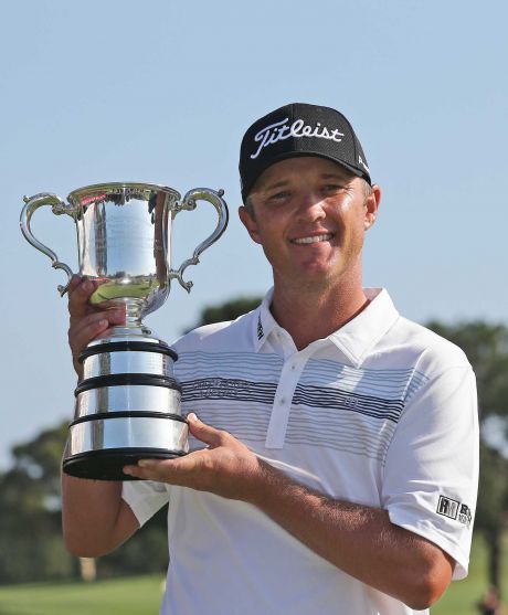 Matthew Jones of Australia holds the Stone Haven Cup after winning the Australian Open golf tournament in Sydney Sunday Nov. 29 2015