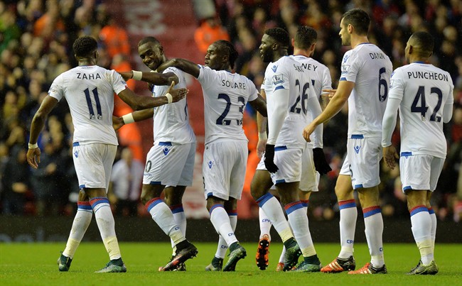 Crystal Palace's Yannick Bolasie second left celebrates scoring against Liverpool during the English Premier League soccer match at Anfield Liverpool England Sunday Nov. 8 2015. UNITED KINGDOM OUT NO SALES NO ARCHIVE