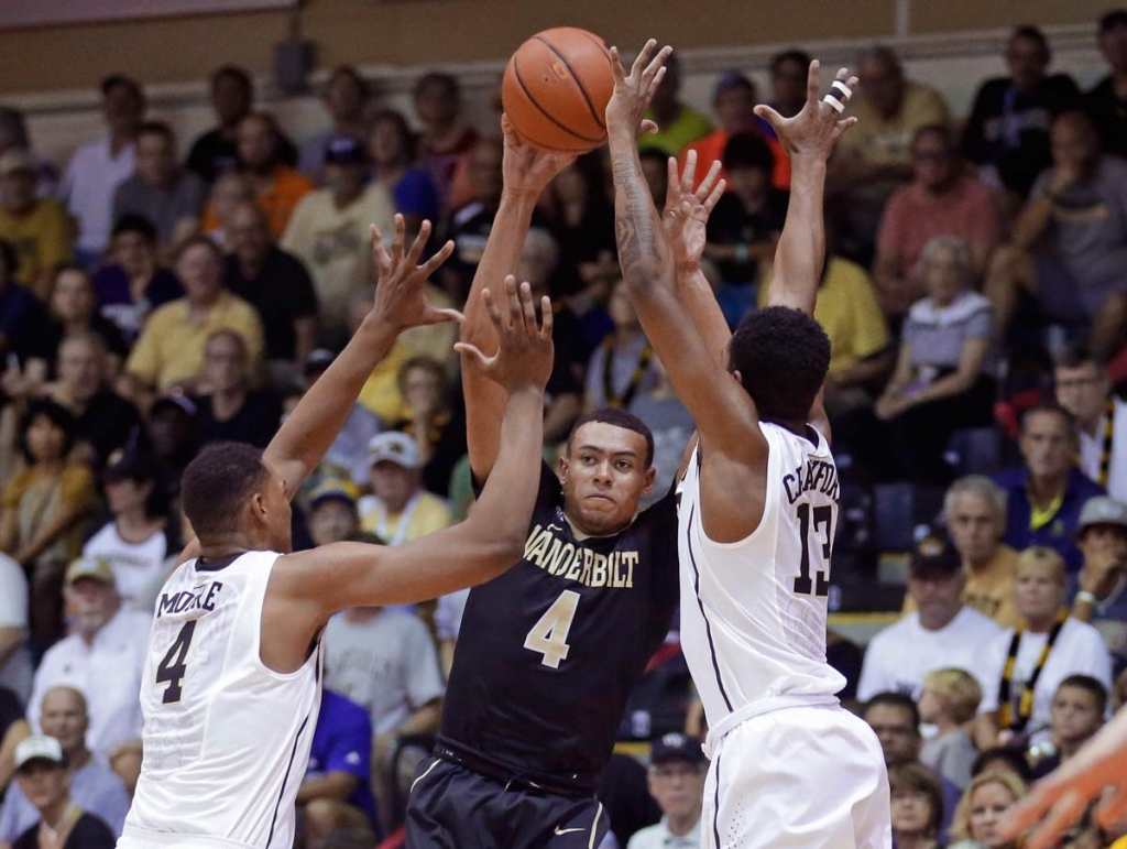 Vanderbilt guard Wade Baldwin IV passes the ball as Wake Forest's Doral Moore and Bryant Crawford defend during the first half of an NCAA college basketball game in the second round of the Maui Invitational Tuesday Nov. 24 2015 in La