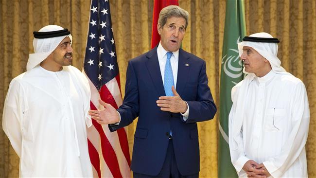 US Secretary of State John Kerry gestures alongside United Arab Emirates Foreign Minister Sheikh Abdullah bin Zayed al Nahyan, and Saudi Foreign minister Adel al Jubeir in Abu Dhabi