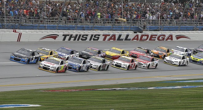 Jeff Gordon and Kasey Kahne lead the pack to the start of the NASCAR Sprint Cup Series auto race at Talladega Superspeedway Sunday Oct. 25 2015 in Talladega Ala. Jeff Gordon, right and Kasey Kahane lead the field