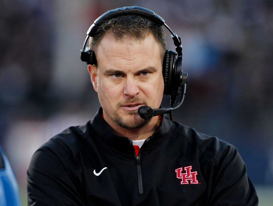 Houston head coach Tom Herman watches his team on the sideline during the first half of an NCAA college football game against Connecticut Saturday Nov. 21 2015 in East Hartford Conn