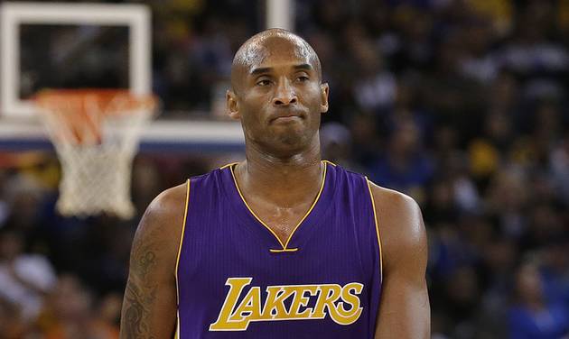 Lakers guard Kobe Bryant walks on the floor during the second half of an NBA basketball game against the Golden State Warriors in Oakland Calif. Tuesday Nov. 24 2015. The Warriors won 111-77