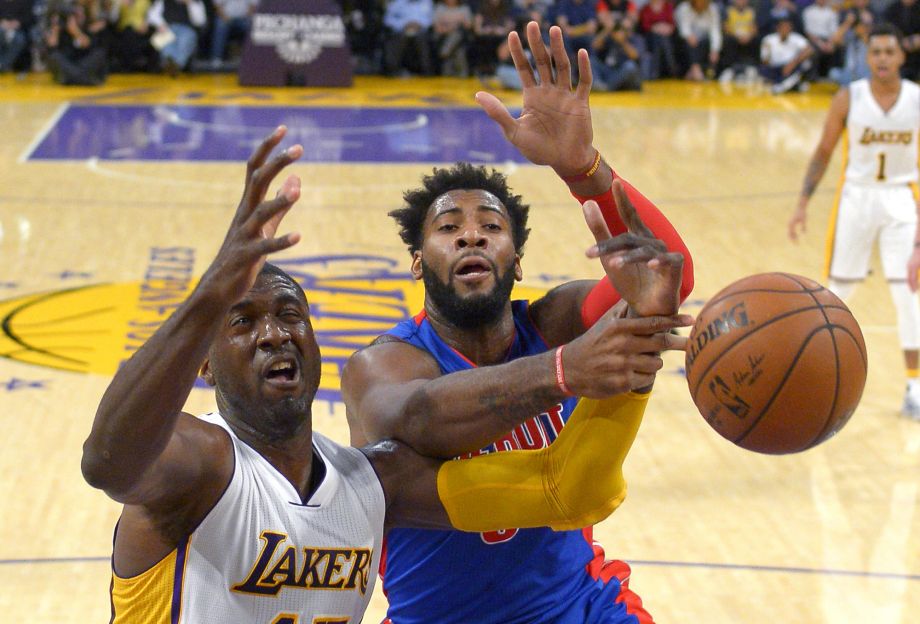 Los Angeles Lakers center Roy Hibbert left and Detroit Pistons center Andre Drummond reach for a rebound during the first half of an NBA basketball game Sunday Nov. 15 2015 in Los Angeles