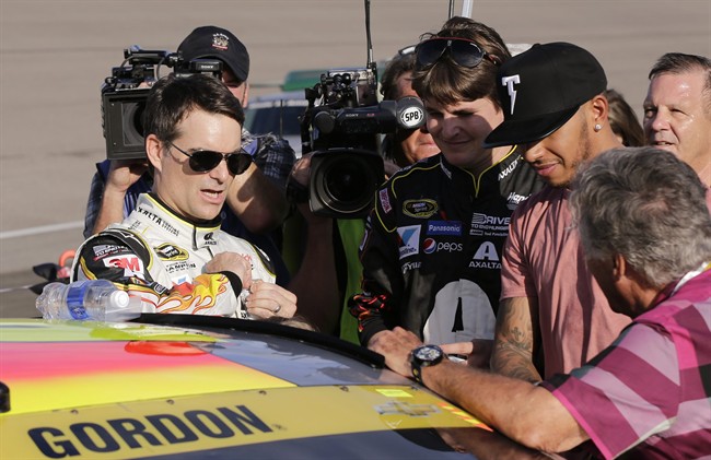 Jeff Gordon left prepares to get into his car before the NASCAR Sprint Cup Series auto race Sunday Nov. 22 2015 at Homestead Miami Speedway in Homestead Fla