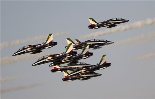 The'Frecce Tri Colori Italian Air Force aerobatic display team perform during the opening of the Dubai Airshow in Dubai United Arab Emirates Sunday Nov. 8 2015