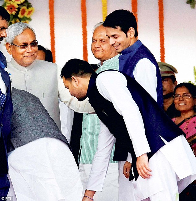 Lalu Prasad's sons seeking blessings from Nitish Kumar at the swearing-in ceremony