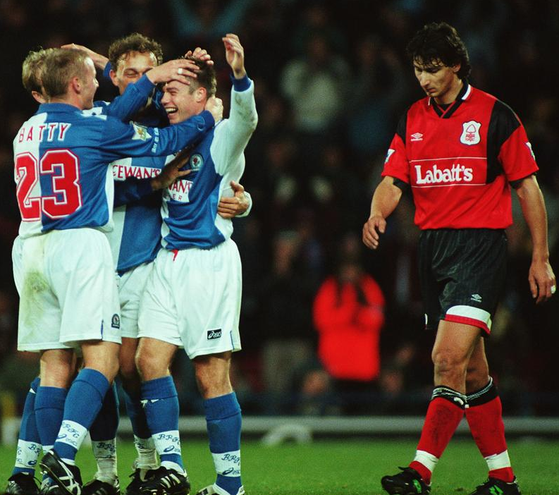 Le Saux celebrates during his time at Blackburn Rovers