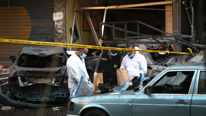 Lebanese army investigators work at the site of an explosion in a southern suburb of Beirut Lebanon Tuesday Jan. 21 2014. — AP