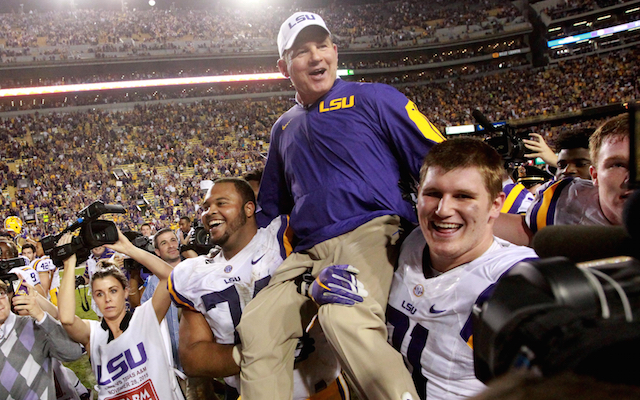 Les Miles gets carried off the field after beating Texas A&M