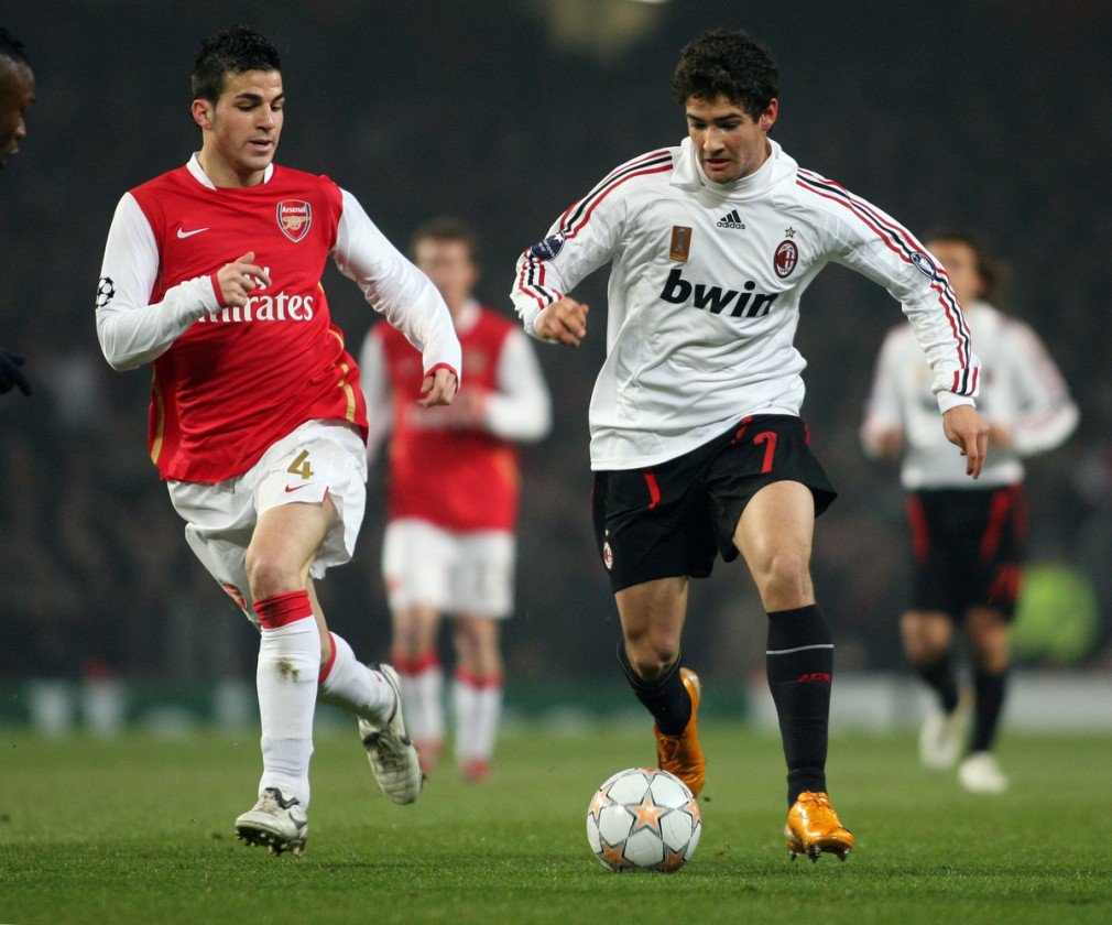 Arsenal's Cesc Fabregas in action against AC Milan's Pato during the UEFA Champions 1st Knockout Round 1st Leg match at The Emirates Stadium