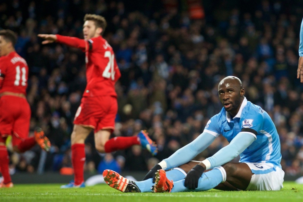 Manchester City's Eliaquim Mangala looks dejected as Liverpool score the third goal during the Premier League match at the City of Manchester Stadium