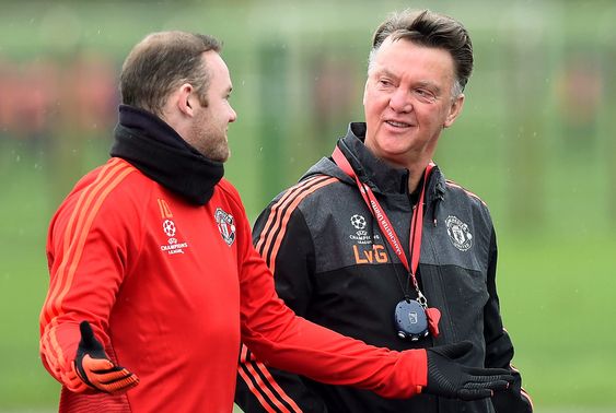 Louis van Gaal right talks with Wayne Rooney during a training session at the team's training complex in Manchester England Tuesday Nov. 24 2015. United will play PSV Eindhoven in a Champions League soccer match on We