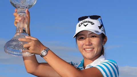 Lydia Ko of New Zealand poses with the Rolex Player of the Year trophy