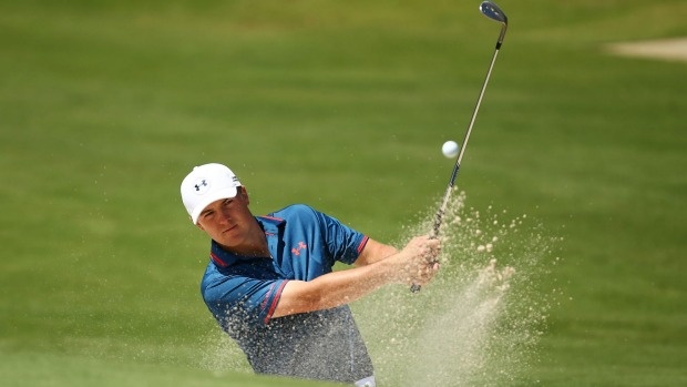 Jordan Spieth plays a bunker shot on the 8th hole during a practice round ahead of the 2015 Australian Open