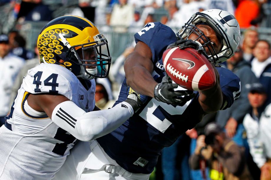 Michigan safety Delano Hill pushes Penn State wide receiver Chris Godwin out of the end zone as he attempts to hold onto a pass from Christian Hackenberg during the first half of an NCAA college football game in State College Pa. Saturday Nov