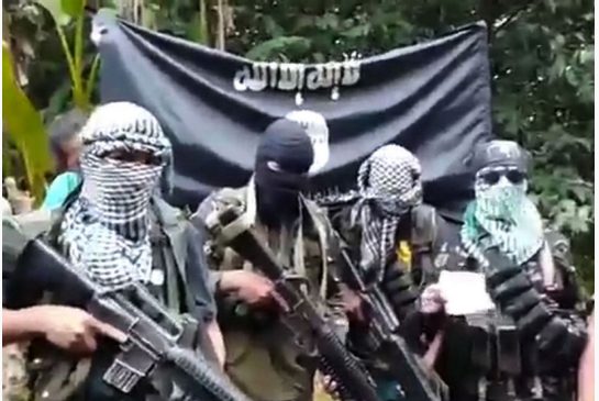 A screen grab from a video uploaded to Youtube Oct. 13 is believed to show heavily armed Sayyaf terrorists
following the kidnapping in September of four people including a Norwegian two Canadians and a Philippine citizen