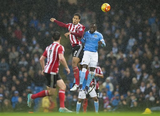 In duel Manchester City's Bacary Sagna right fights for the ball against Southampton's Virgil van Dijk during the English Premier League soccer match between Manchester City and Southampton at the Etihad Stadium Manchester England Saturday. (AP  Jon