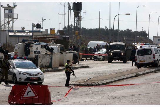 Israeli security forces gather at the scene where a Palestinian man was shot dead by security forces after ramming his car into a group of Israelis at Tapuah junction south of Nablus in the Israeli-occupied West Bank