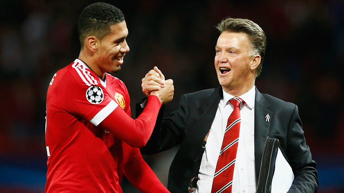 Manchester United defender Chris Smalling with manage Louis van Gaal. 
    
    
                
          
          Show Grid