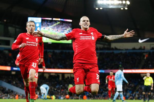 Martin Skrtel celebrates scoring the fourth goal for Liverpool against Manchester City at the Etihad Stadium