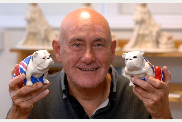 Master painter Chris Jackson with two of the ceramic bulldogs       	      	     VIEW