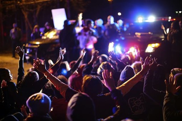 Protesters camp out overnight, demand names of officers who shot suspect