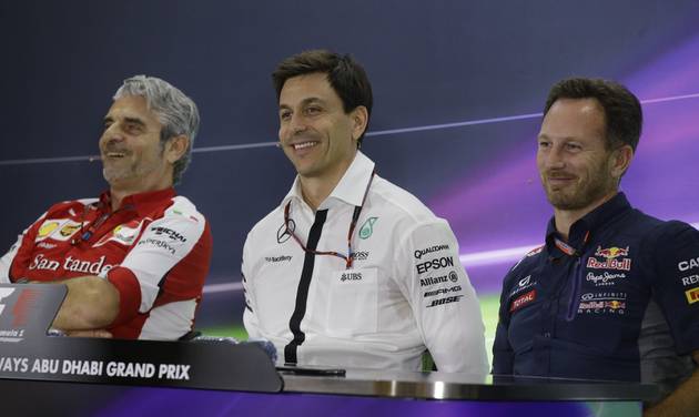 Ferrari team principal Maurizio Arrivabene flanked by Mercedes team principal Toto Wolff and Red Bull team principal Christian Horner attend a news conference at the Yas Marina racetrack in Abu Dhabi United Arab Emirates Friday Nov