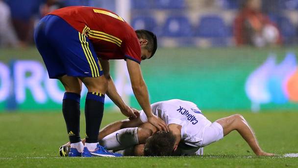 Michael Carrick went down injured in the 2-0 loss to Spain