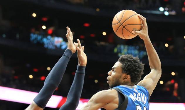 Andrew Wiggins shoots over Atlanta Hawks Paul Millsap during the second half of an NBA basketball game Monday Nov. 9 2015 in Atlanta. MARIETTA DAILY OUT GWINNETT DA