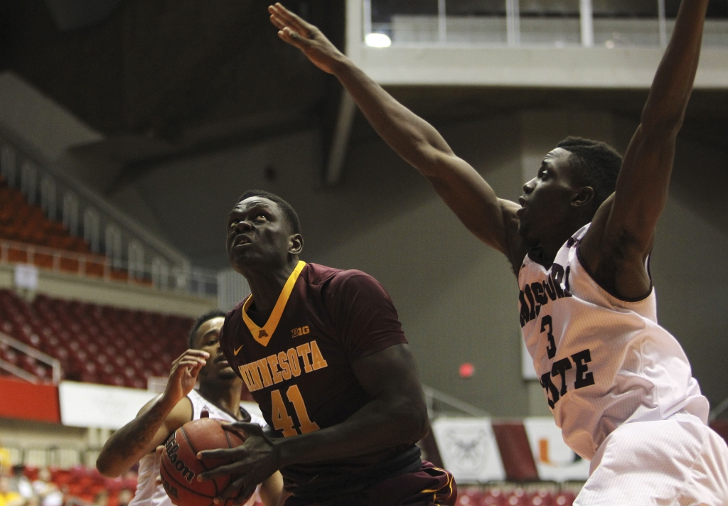 Missouri State guard Loomis Gerring right looks to shoot pressured by Minnesota forward Gaston Diedhiou during the Puerto Rico Tip Off college basketball tournament in San Juan Friday Nov. 20 2015