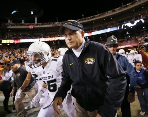 Missouri head coach Gary Pinkel second from right