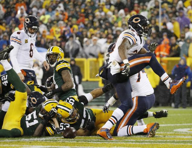 Morry Gash  AP  Chicago Bears Jeremy Langford celebrates his touchdown run during the first half of an NFL football game against the Green Bay Packers